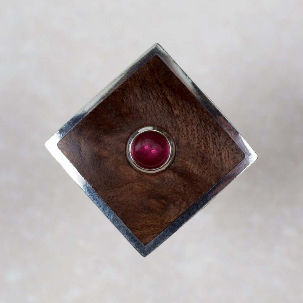 Sterling Silver Dress Ring with a Bezel Set Garnet surrounded by Walnut Burl