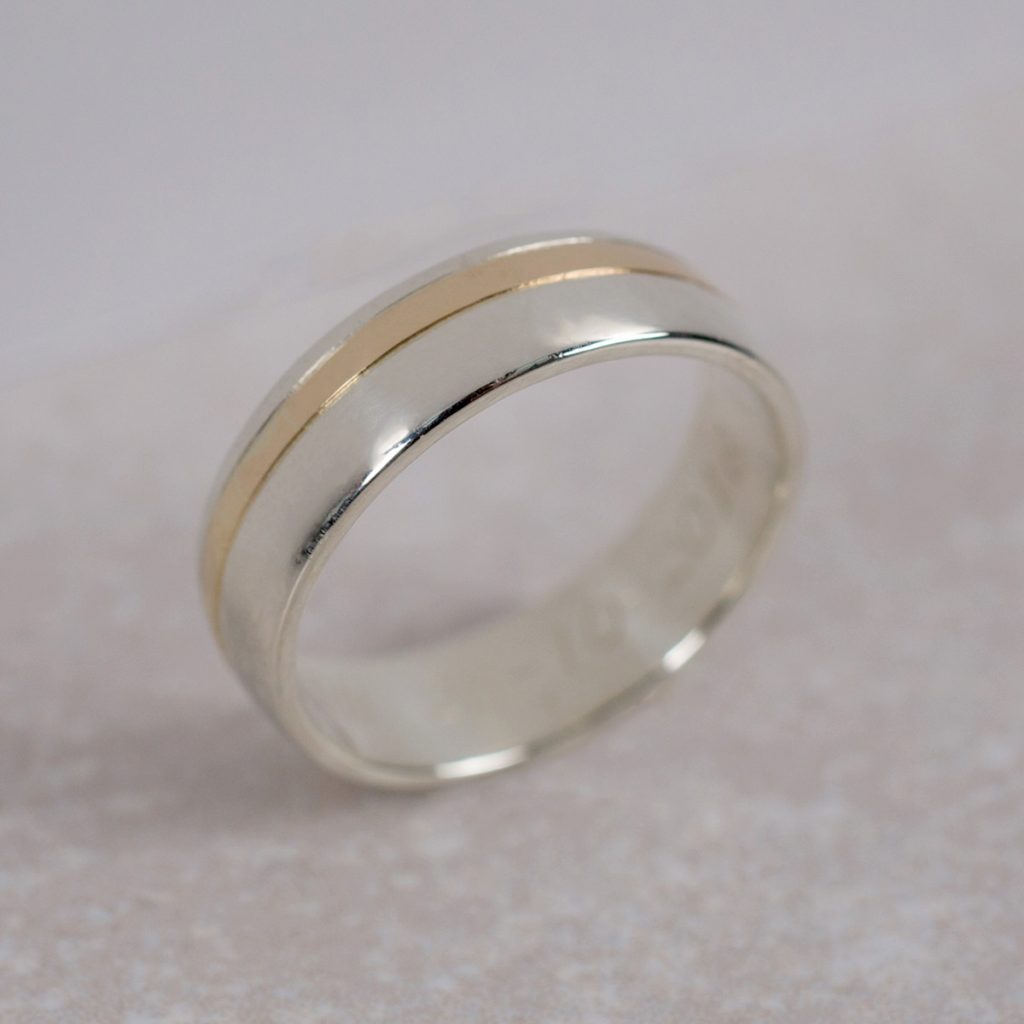 Family Gold Wedding Band, "encased" in a larger white gold Wedding band