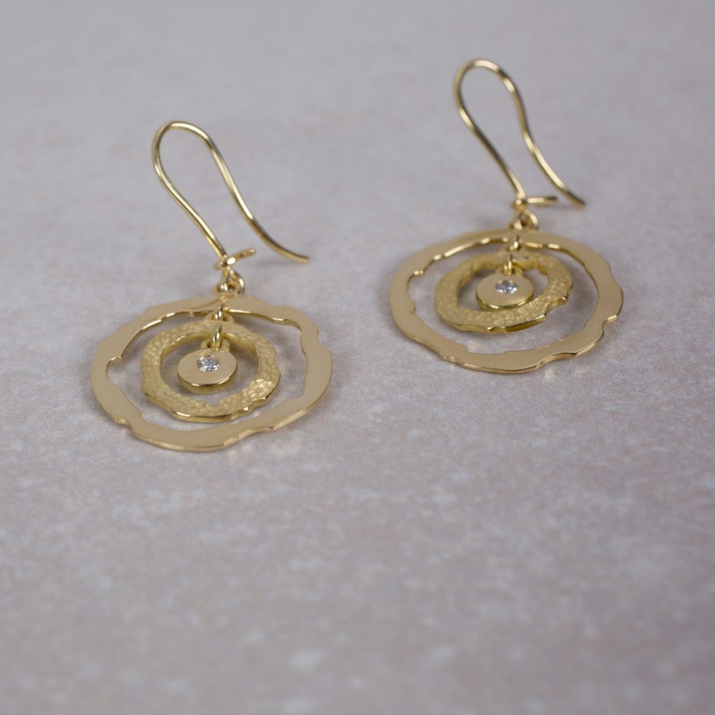 Custom Made 18 Carat Gold Earrings, set with a round Brilliant Cut Diamond